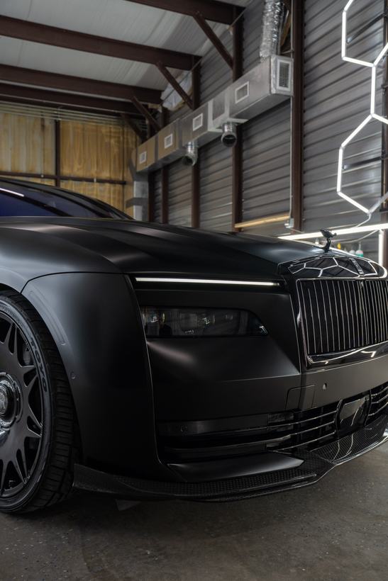 Satin black Rolls-Royce front three-quarter in the Delicate Details shop