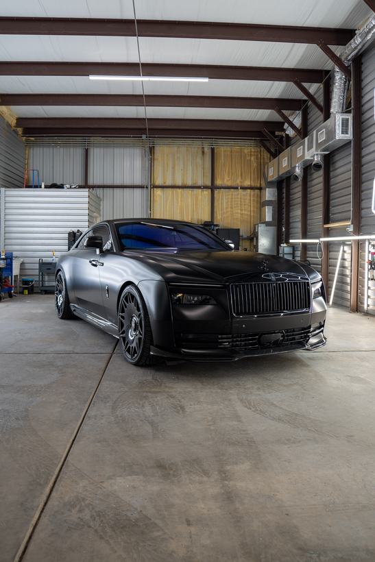 Rolls-Royce side profile showing satin paint under shop lighting