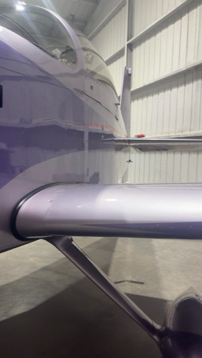 Aircraft fuselage and wing reflecting after paint correction in Lubbock TX
