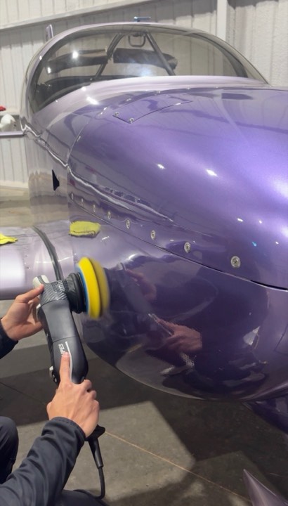 Machine polishing an aircraft cowling in a Lubbock TX hangar