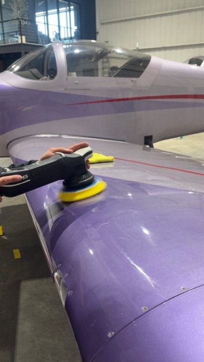 Machine polishing an aircraft wing in a Lubbock TX hangar