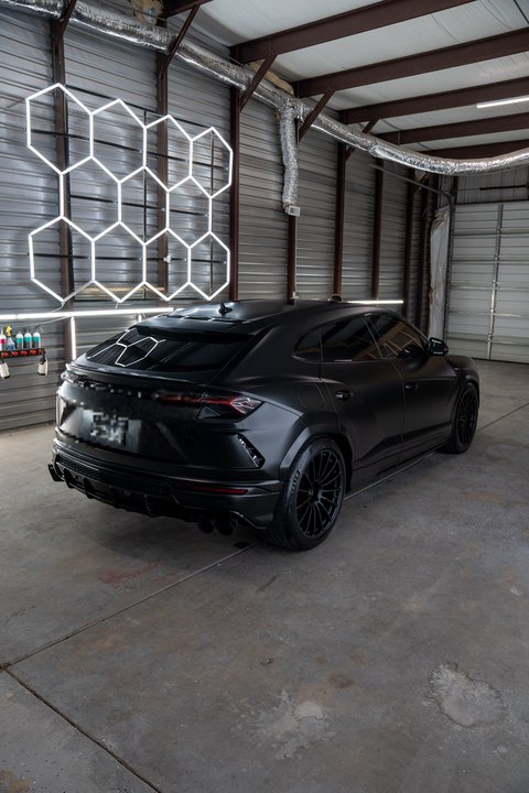 Satin black Lamborghini Urus rear three-quarter in our Lubbock TX shop